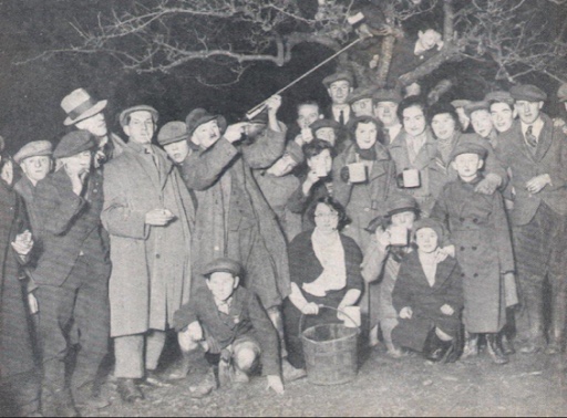 Wassailers firing shotguns during an apple wassail in the 1950s